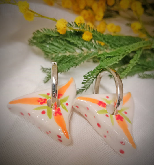 Pendientes Yoni naranja plateado.